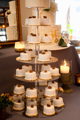 Sweet mini wedding cream cakes with glaze