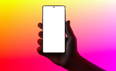 Hand holding phone. Silhouette of male hand holding smartphone isolated on multicolored background. Bezel-less screen is cut with clipping path. - 357687978