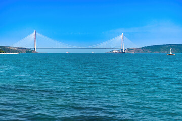 Yavuz Sultan Selim bridge view from distance and cargo ships
