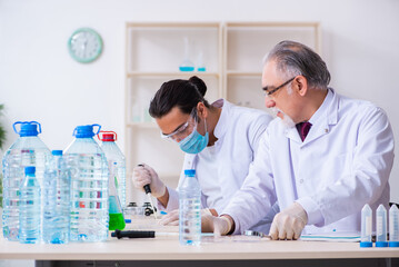 Two chemists working in the lab