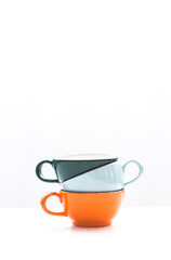 Hill of cups of coffee on white background