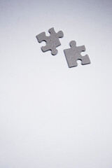 gray puzzles on a white background. isolated. Top view, copy space. . High quality photo