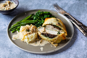 Chicken Wellington with creamy mustard sauce, spinach and green beans