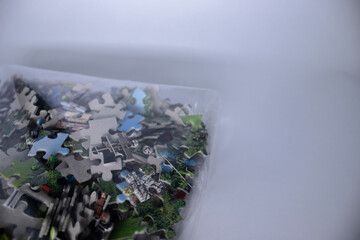 packing with multicoloured puzzles on a white background. isolated. High quality photo