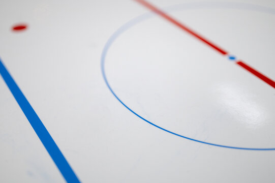 Closeup of a flipchart with ice hockey rink markings on it.