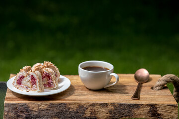 Pavlova roll with coffee for breakfast
