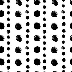 Seamless pattern from black abstract big and small ink circles realistic on a white background