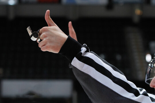 Closeup of Ice hockey referee giving a sign for a penalty.