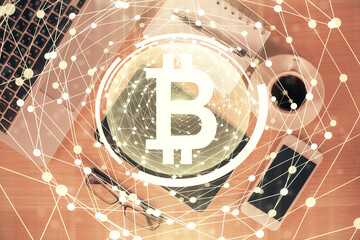 Double exposure of blockchain theme hologram over table with phone. Top view. Crypto technology concept.