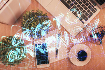 Double exposure of blockchain theme hologram over table with phone. Top view. Crypto technology concept.