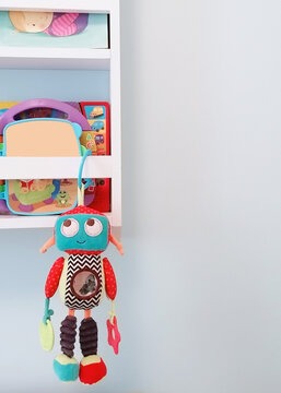 A you robbot for baby on the book shelf in the nursery