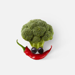 Natural fresh vegetable composition in the shape of funny face.
