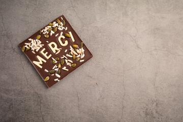 Dark chocolate square with white chocolate thank you note with space to write