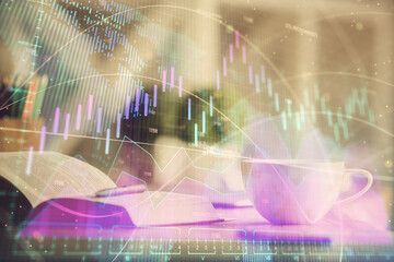 Multi exposure of forex graph drawing and desktop with coffee and items on table background. Concept of financial market trading