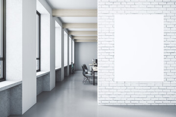 Minimalistic loft interior with blank poster on brick wall.