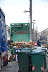 Trucks for collecting bins with waste with food waste at the market