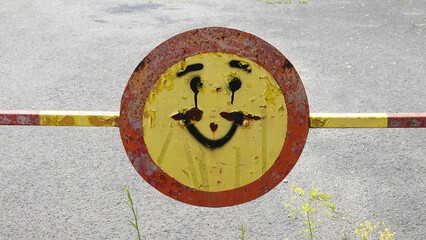 Traffic sign closed road with smiley smile graffiti