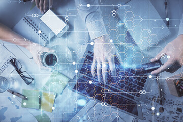 Double exposure of man and woman working together and data theme hologram drawing. Computer background. Top View.