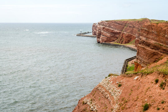 High angle view of the rock on Heligoland island against blue sea and clear sky