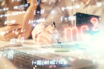 Double exposure of man and woman working together and math formulas hologram drawing. Education concept. Computer background.