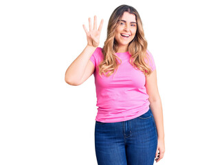 Fototapeta na wymiar Young caucasian woman wearing sportswear showing and pointing up with fingers number four while smiling confident and happy.