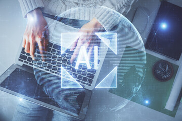 Double exposure of woman hands working on computer and data theme hologram drawing. Top View. Technology concept.