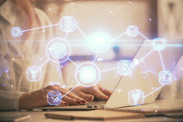 Double exposure of woman hands typing on computer and social network theme hologram drawing. People media concept.