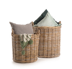 Baskets with pillows and plaid on white background