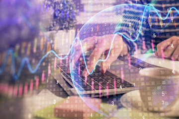 Double exposure of woman hands typing on computer and forex chart hologram drawing. Stock market invest concept.