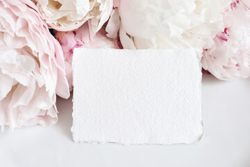 Feminine wedding, birthday mockup scene. Closeup of blank cotton paper card, invitation on pink...