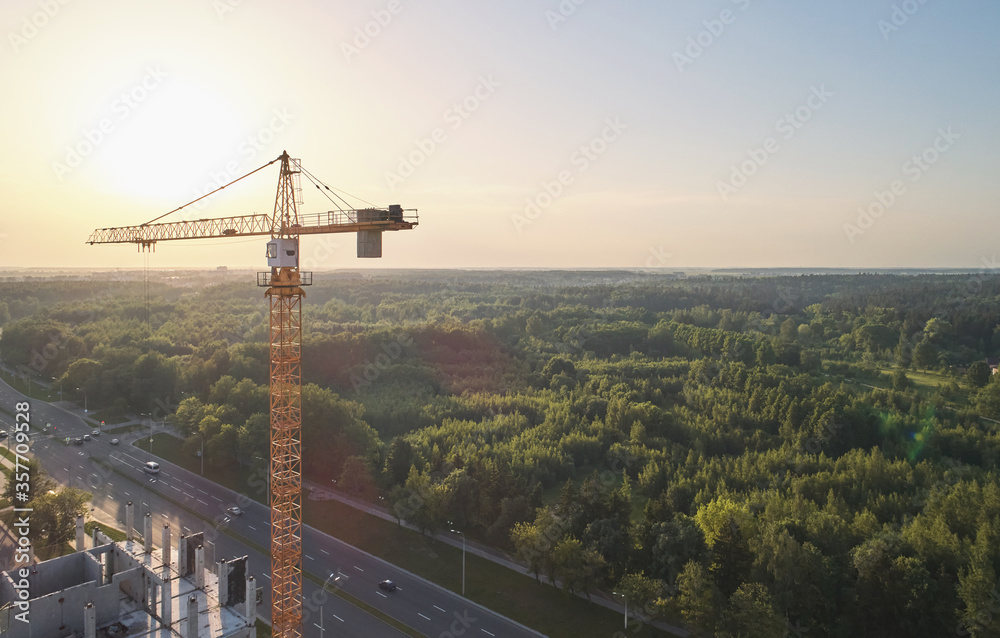 Wall mural construction crane on sunset light