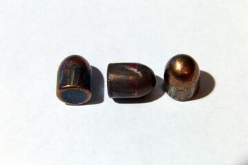 deformed bullet after firing on a white background
