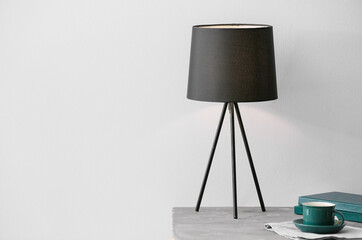 Modern lamp on table in room
