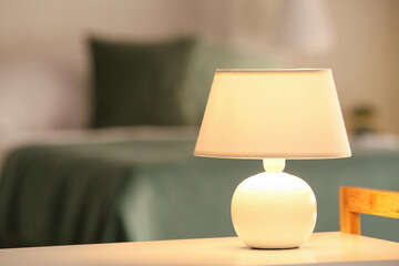Modern lamp on table in room
