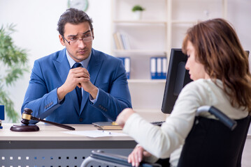 Injured woman and male judge in the courtroom