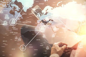 Double exposure of man's hands holding and using a phone and social network theme drawing.