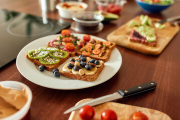 Set with toast bread and different healthy vegetarian toppings on the plate. Vegetarianism, healthy food concept