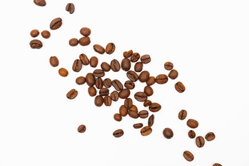 Naklejka premium Coffee beans isolated on white background with copyspace for text. Coffee background or texture concept.