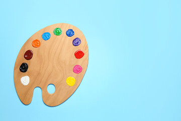 Artist's palette on color background