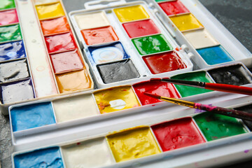 Set of paints on table, closeup