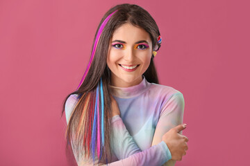 Beautiful young woman with unusual hair on color background