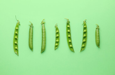 Tasty fresh peas on color background