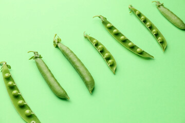 Tasty fresh peas on color background