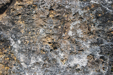 Texture rock colored. Background wall rocks and stones. Exterior walls of natural mountain materials and minerals. 
Street wall of graffiti.