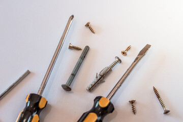 Top view of screwdrivers with screws for home DIY repairs