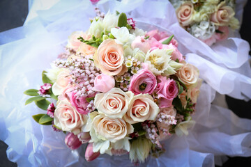Floral wedding bouquet in natural garden setting