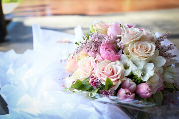 Floral wedding bouquet in natural garden setting