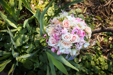 Floral wedding bouquet in natural garden setting