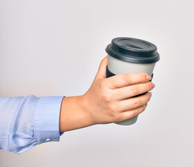 Hand of caucasian young woman holding cup of takeaway coffee over isolated white background