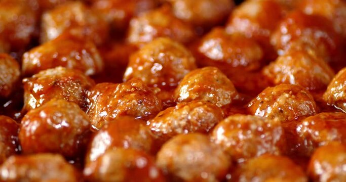 Meatballs in tomato sauce fried with air bubbles.